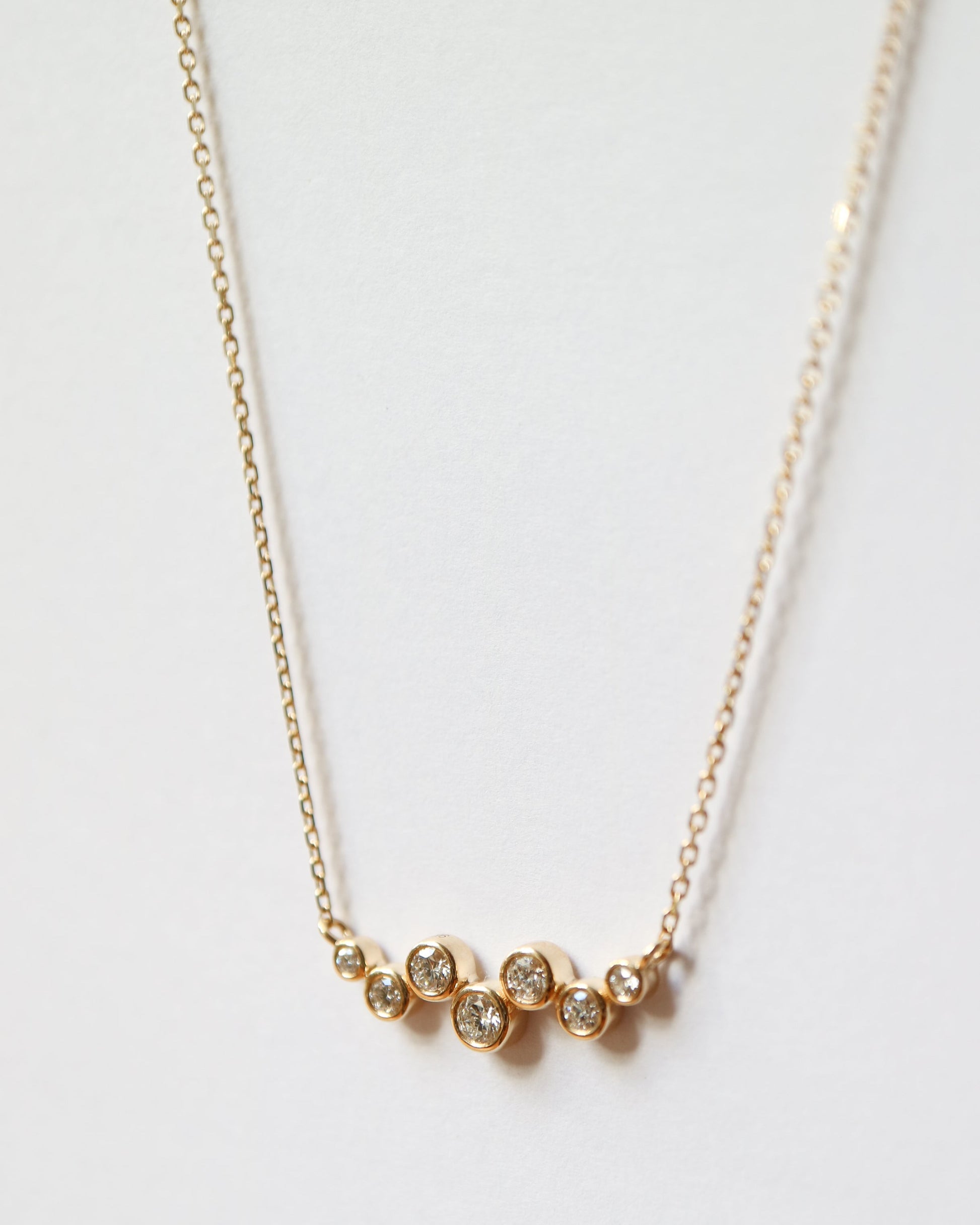 9ct gold necklace with seven round diamonds