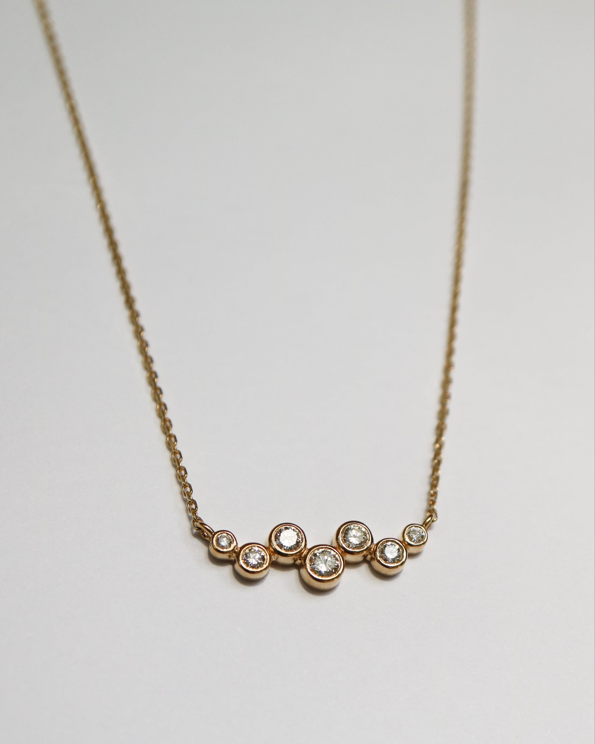 9ct gold necklace with seven round diamonds