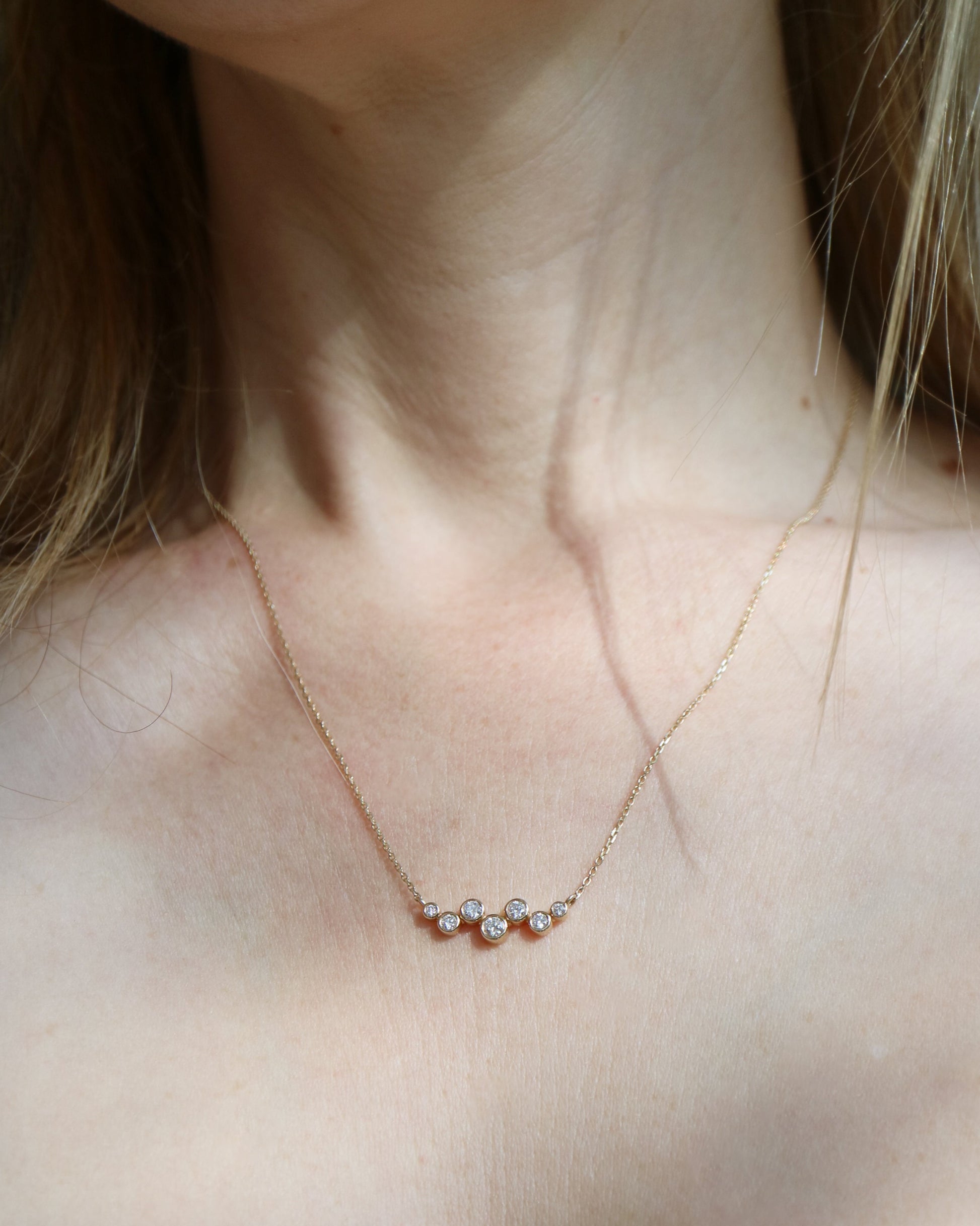 9ct gold necklace with seven round diamonds