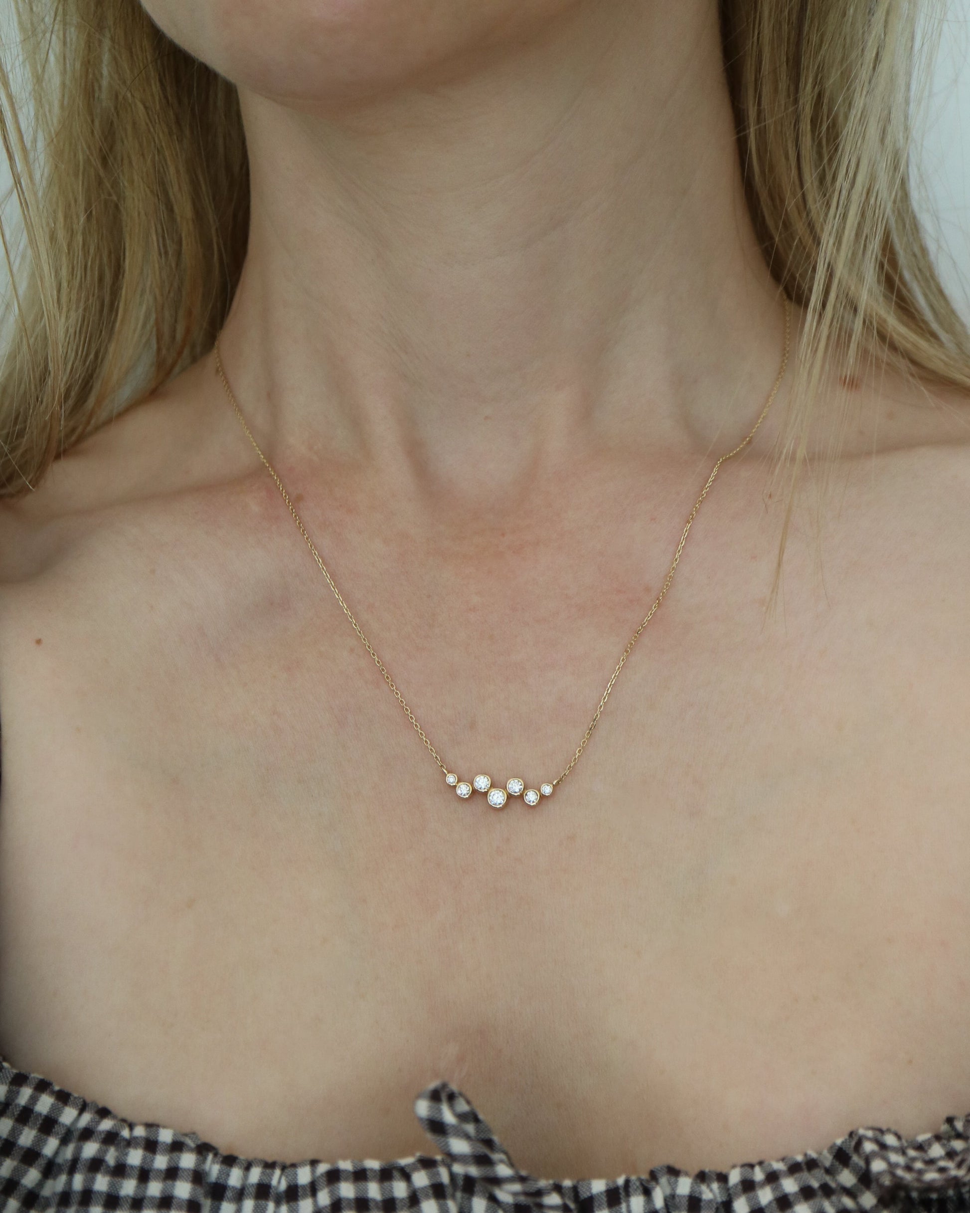 9ct gold necklace with seven round diamonds