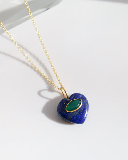 Necklace with a blue heart-shaped pendant on a white background