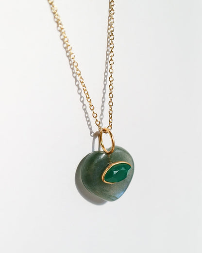 Necklace with a green pendant on a white background