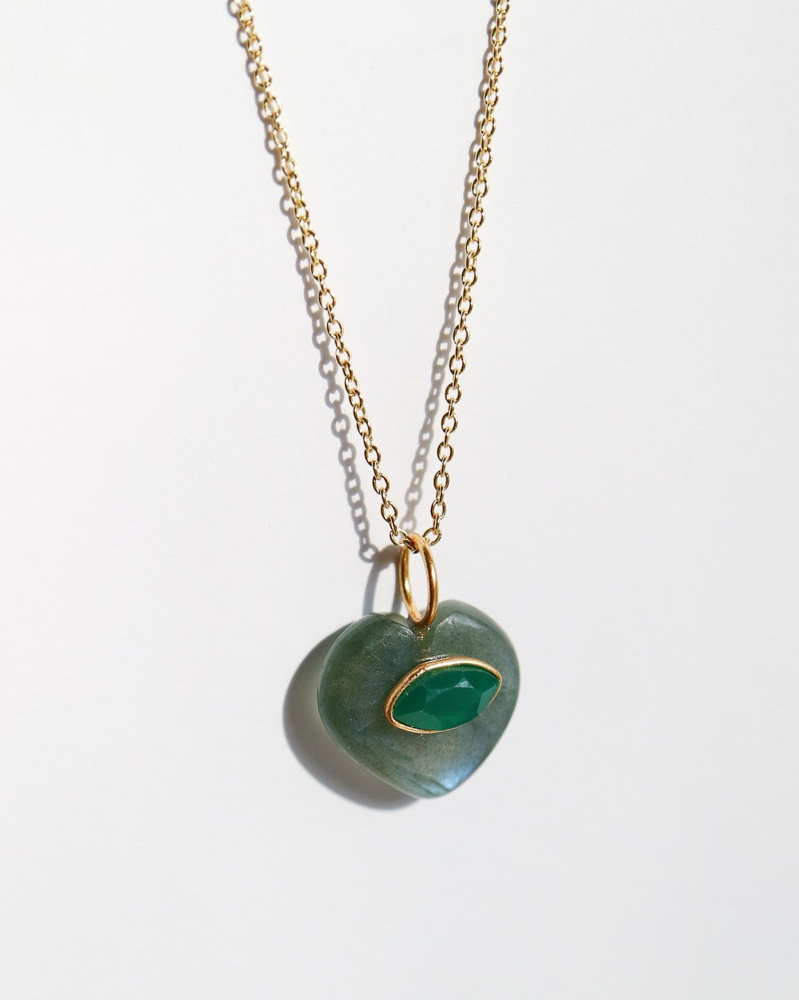 Necklace with a green pendant on a white background
