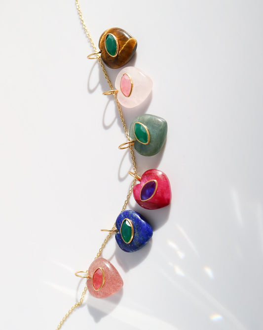 Necklace with colorful stone pendants on a white background