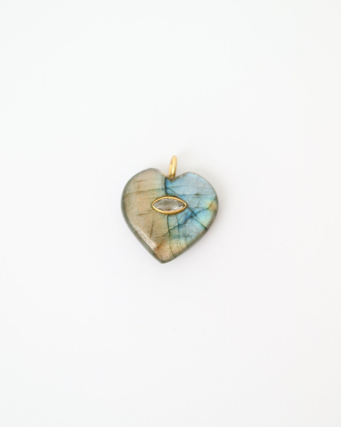 Heart-shaped pendant with a multicolored stone on a white background