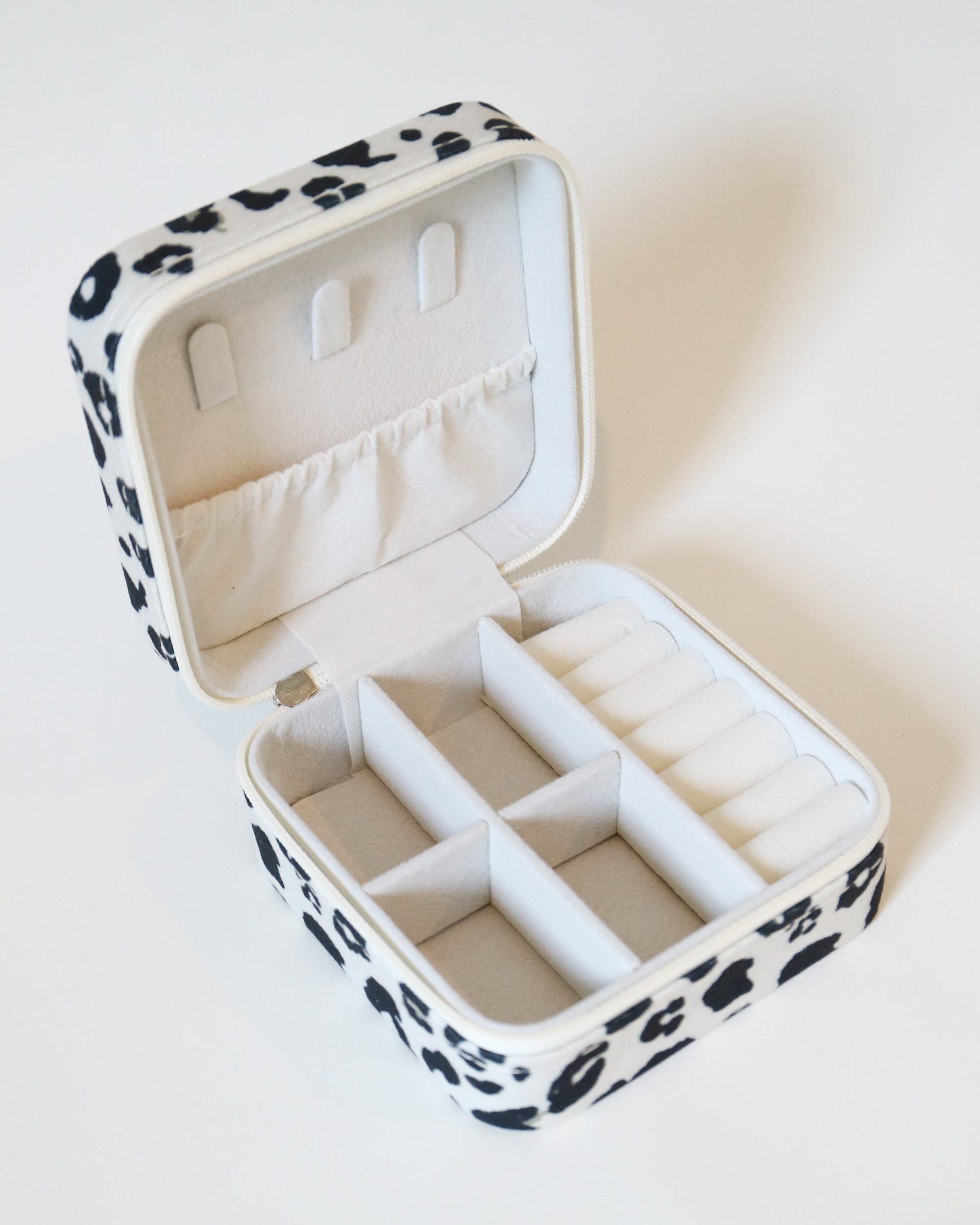 Jewelry box with leopard print exterior and white interior