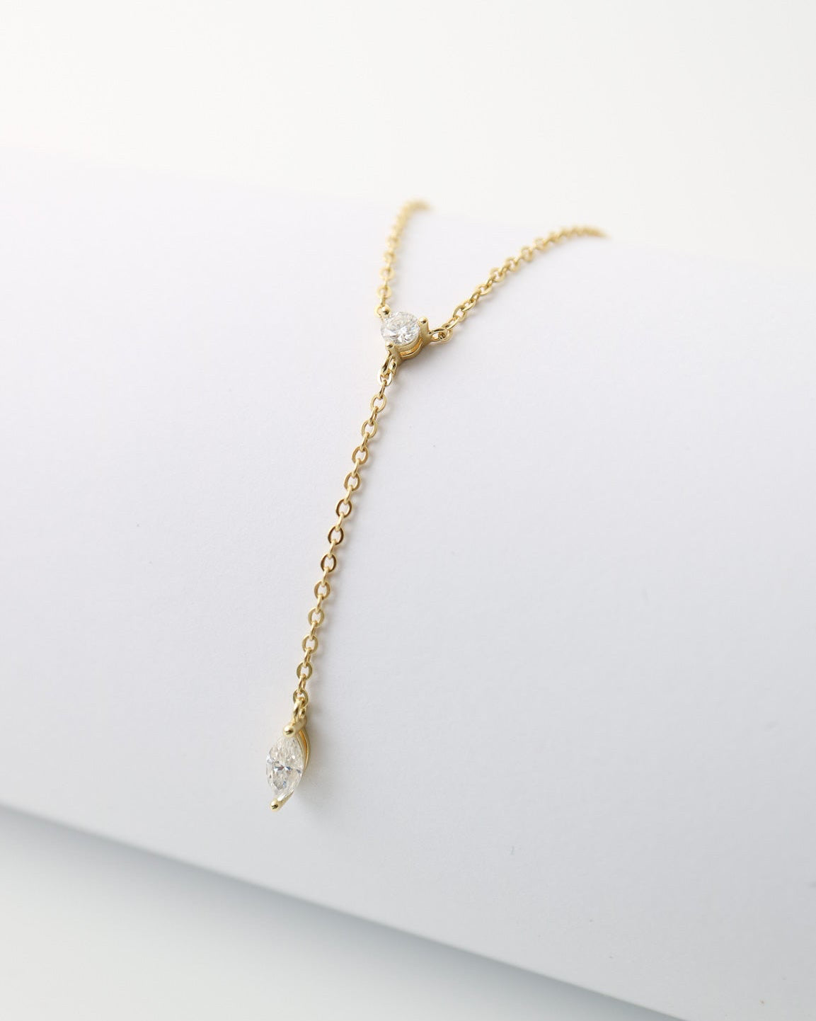 Gold bracelet on a white surface