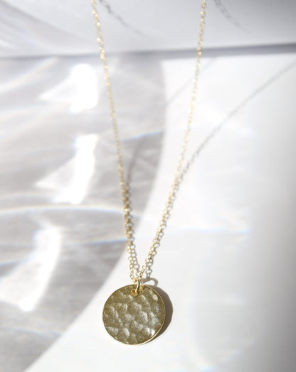 Gold disc pendant