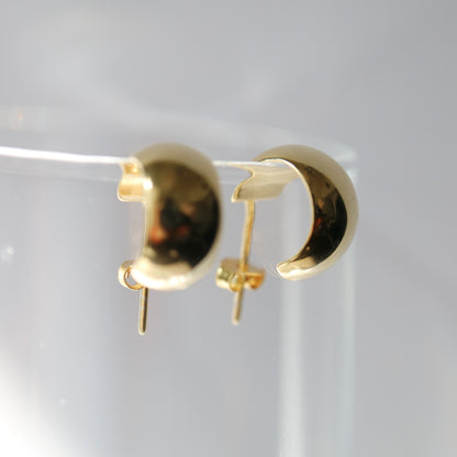 domed wide huggie earrings in gold