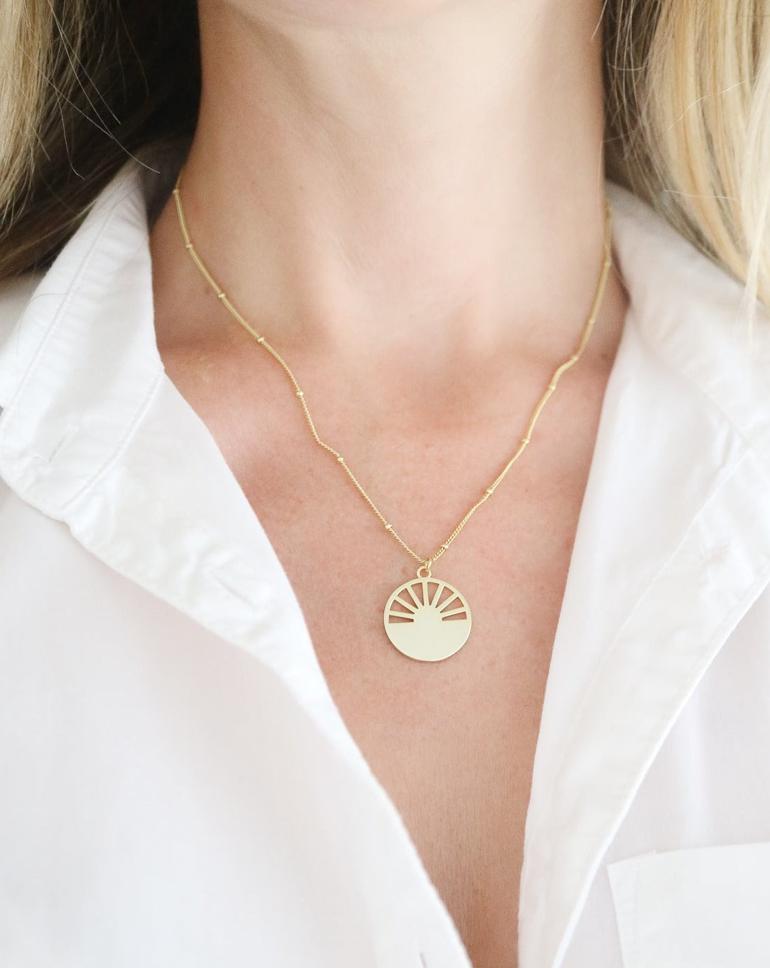 Gold Sunrise Necklace on female neck