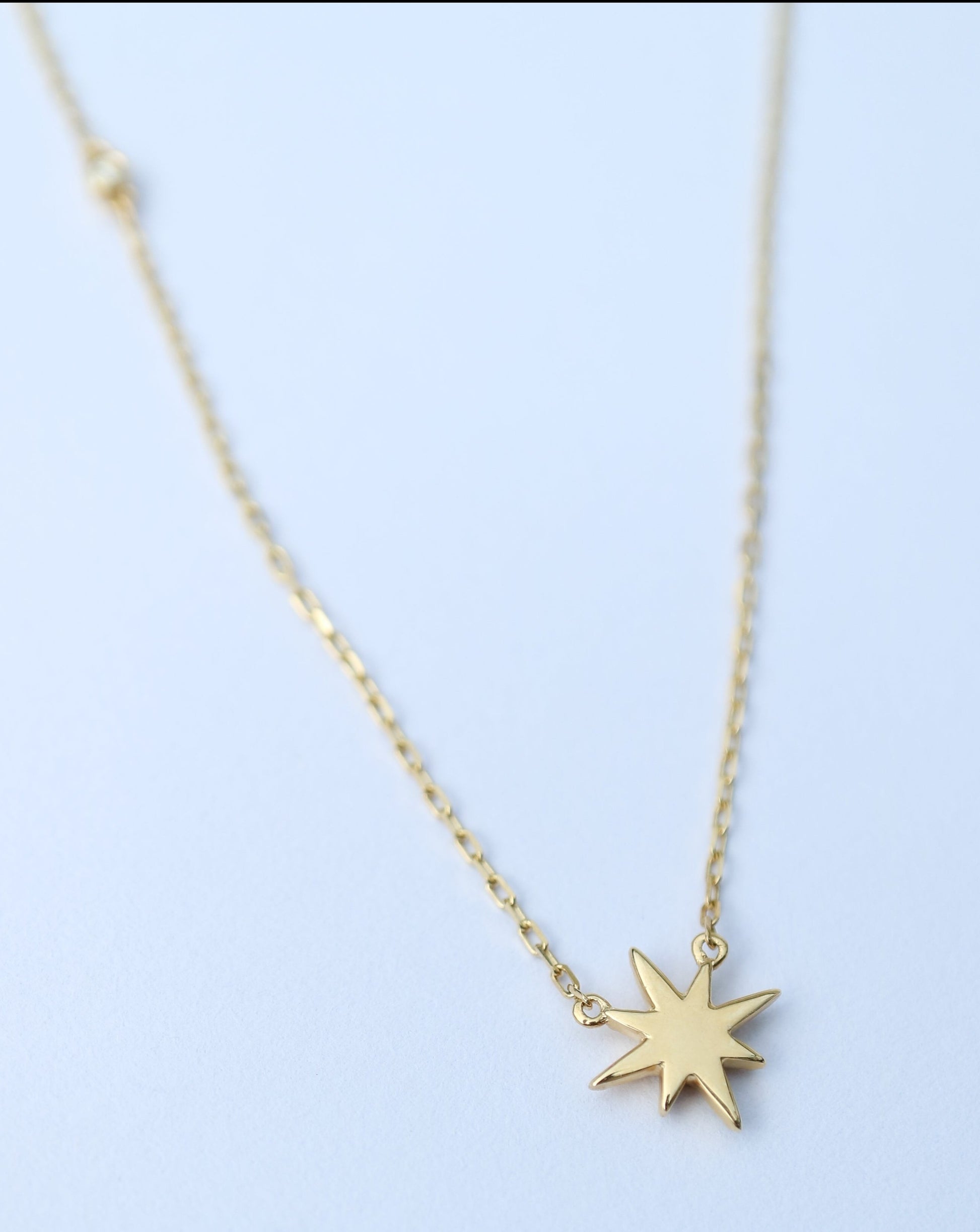 10kt gold and diamond stardust pendant by La Kaiser Jewelry