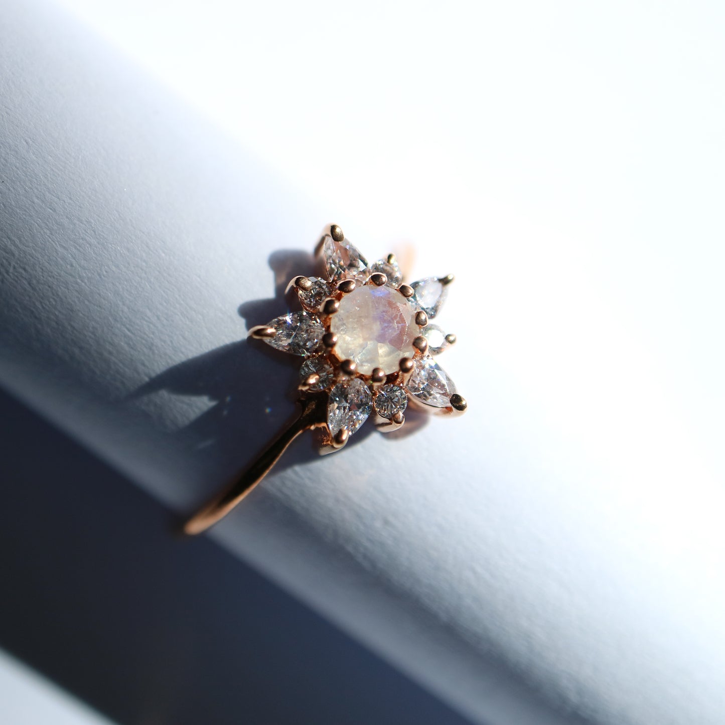 Rose gold, moonstone and topaz dancing flower ring from La Kaiser