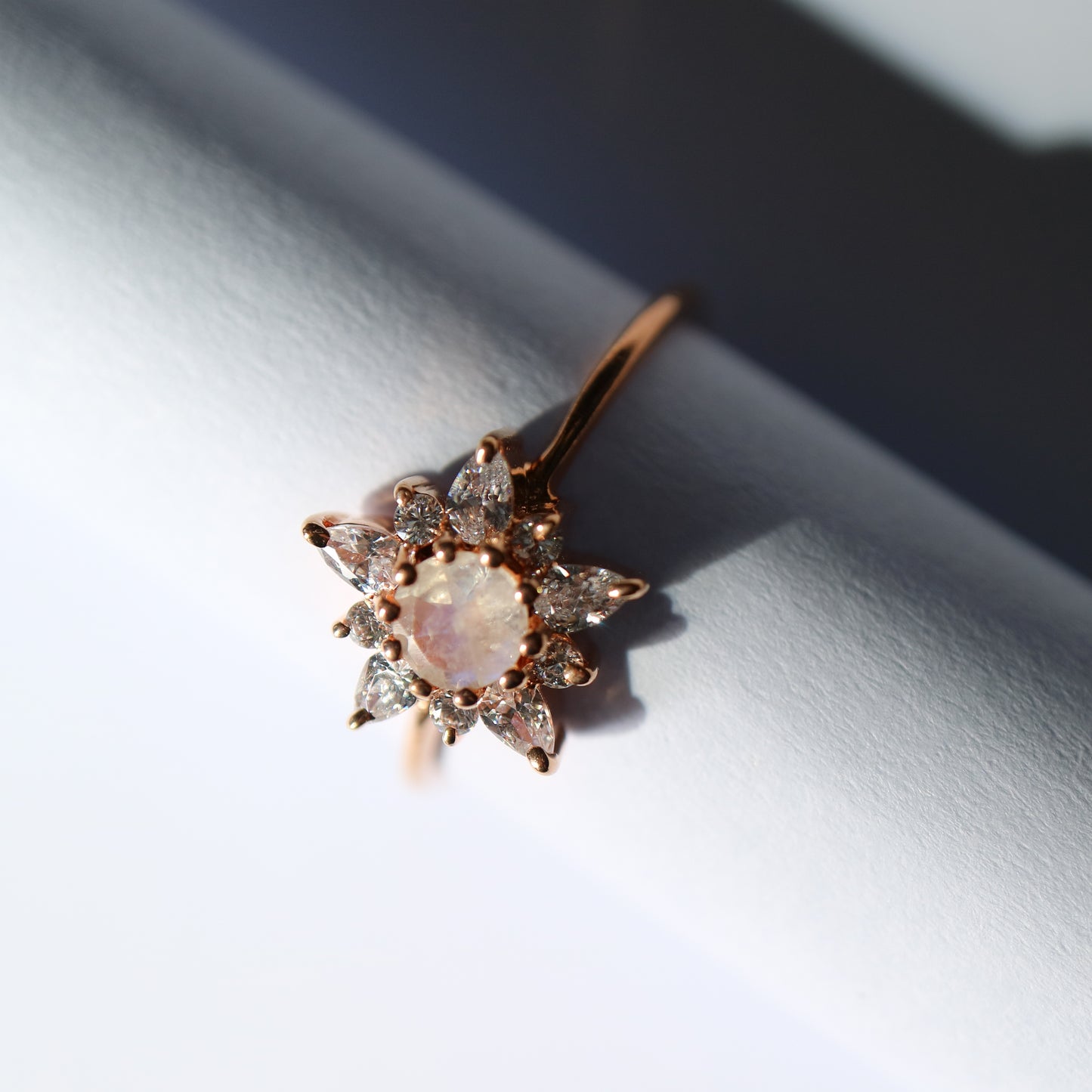 Rose gold, moonstone and topaz dancing flower ring from La Kaiser