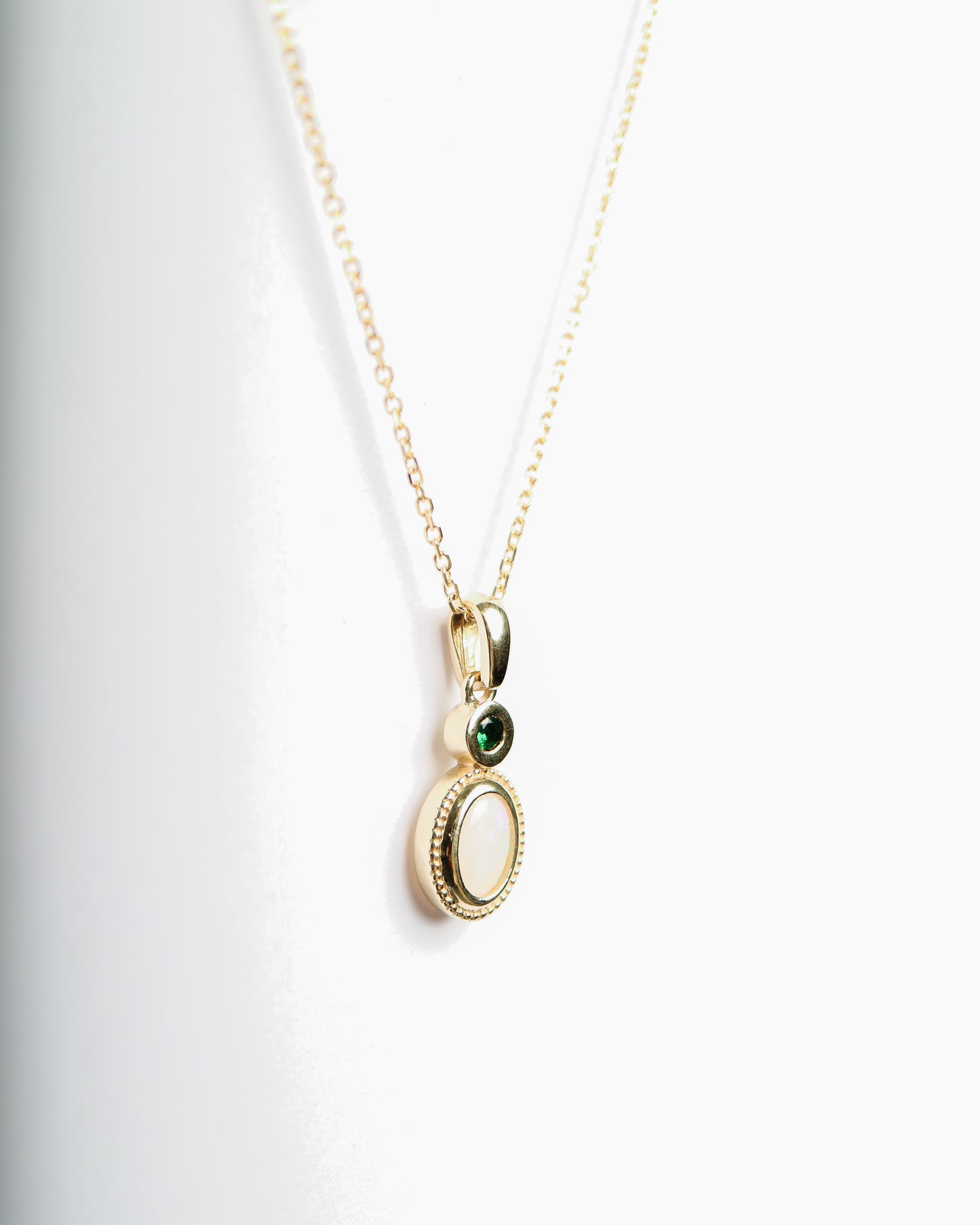 Opal and Tsavorite Pendant in 9ct gold