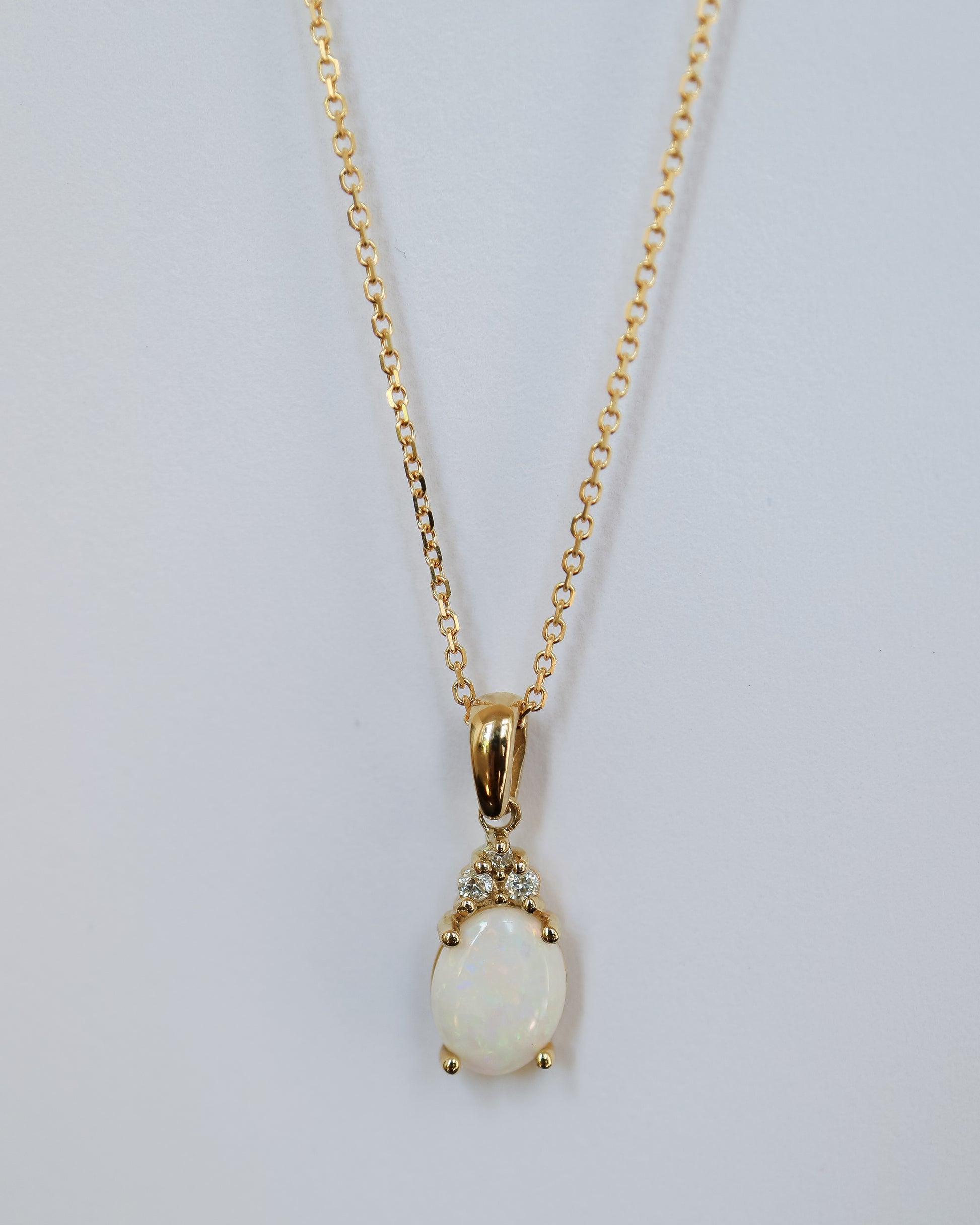 Opal and Diamond pendant in 9ct yellow gold