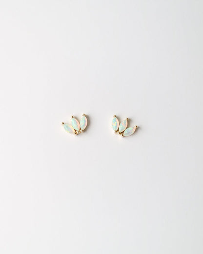 A pair of small gold-toned stud earrings with iridescent pale blue-green opal inlays, shown on a plain white background.