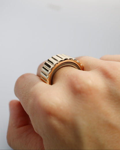 A side up view of the Oura Ring 4 fitted inside a gold vermeil Oura Ring Jacket from Collective & Co. Jewellery Store