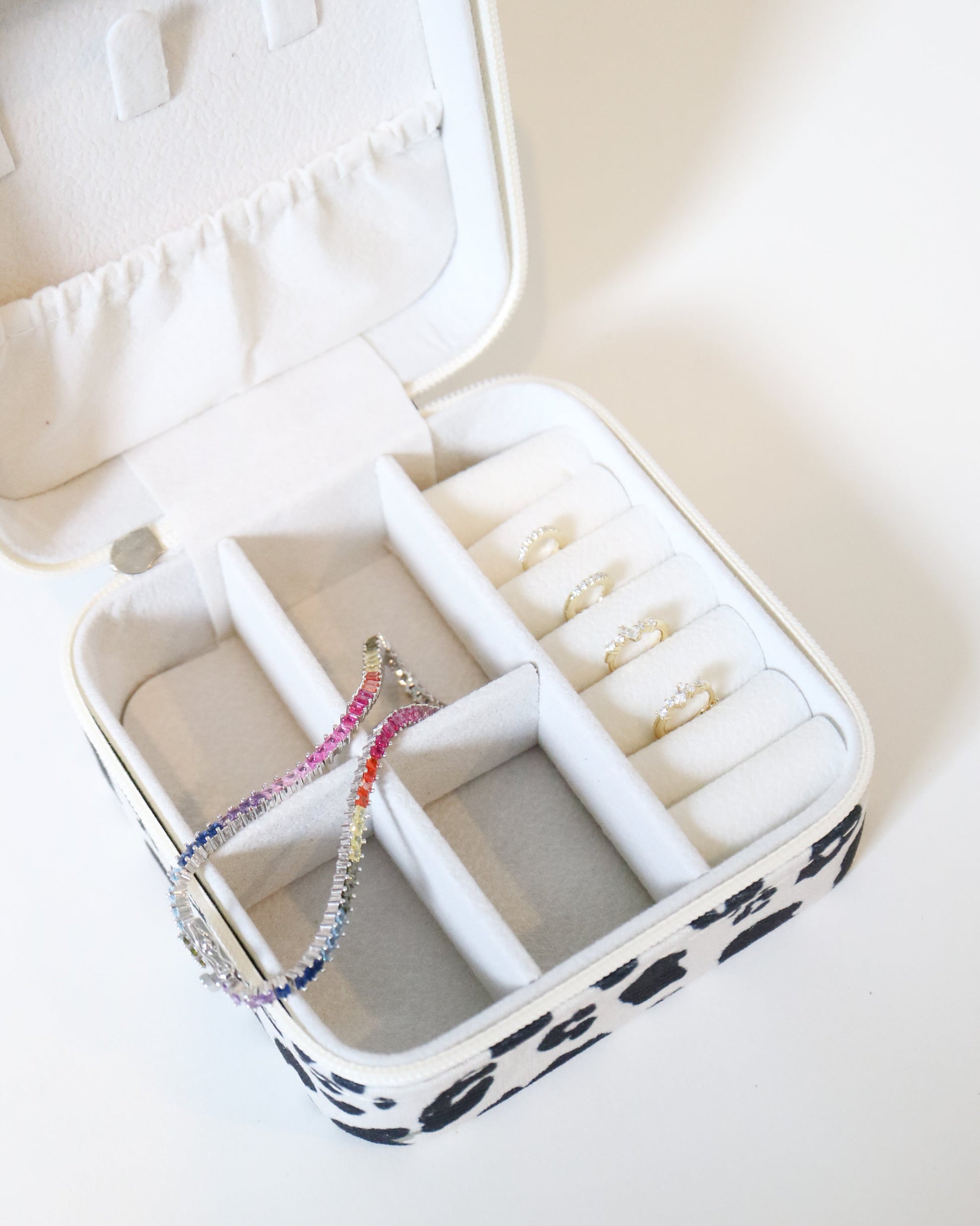 Jewelry box with necklaces and bracelets on a white background