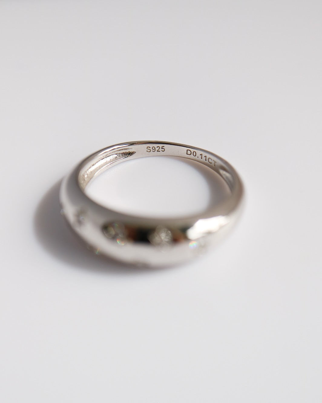 Silver ring on a white background