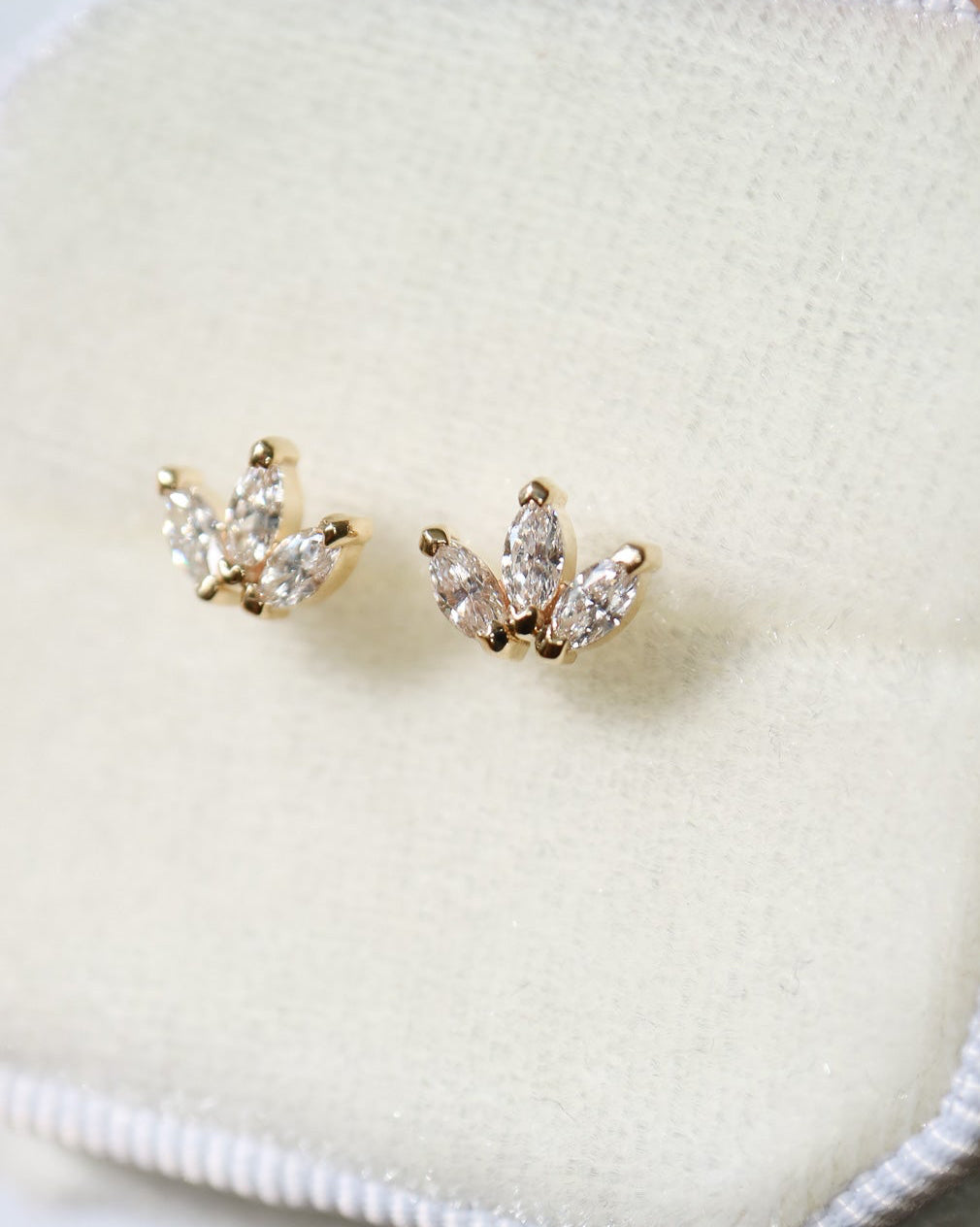 Stud Earrings in 9ct gold with 6 marquise diamonds close up