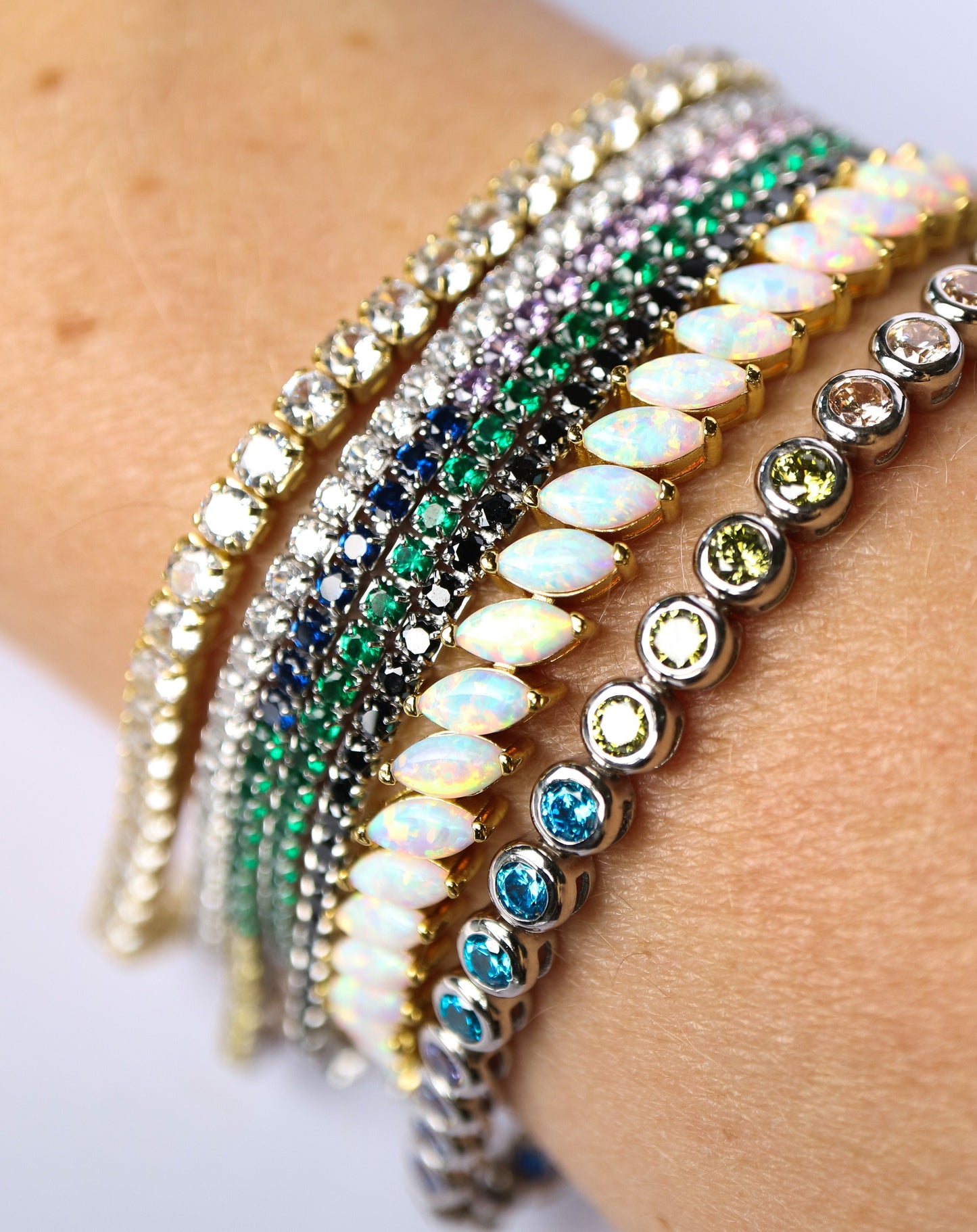 Sterling silver tennis bracelets on female wrist