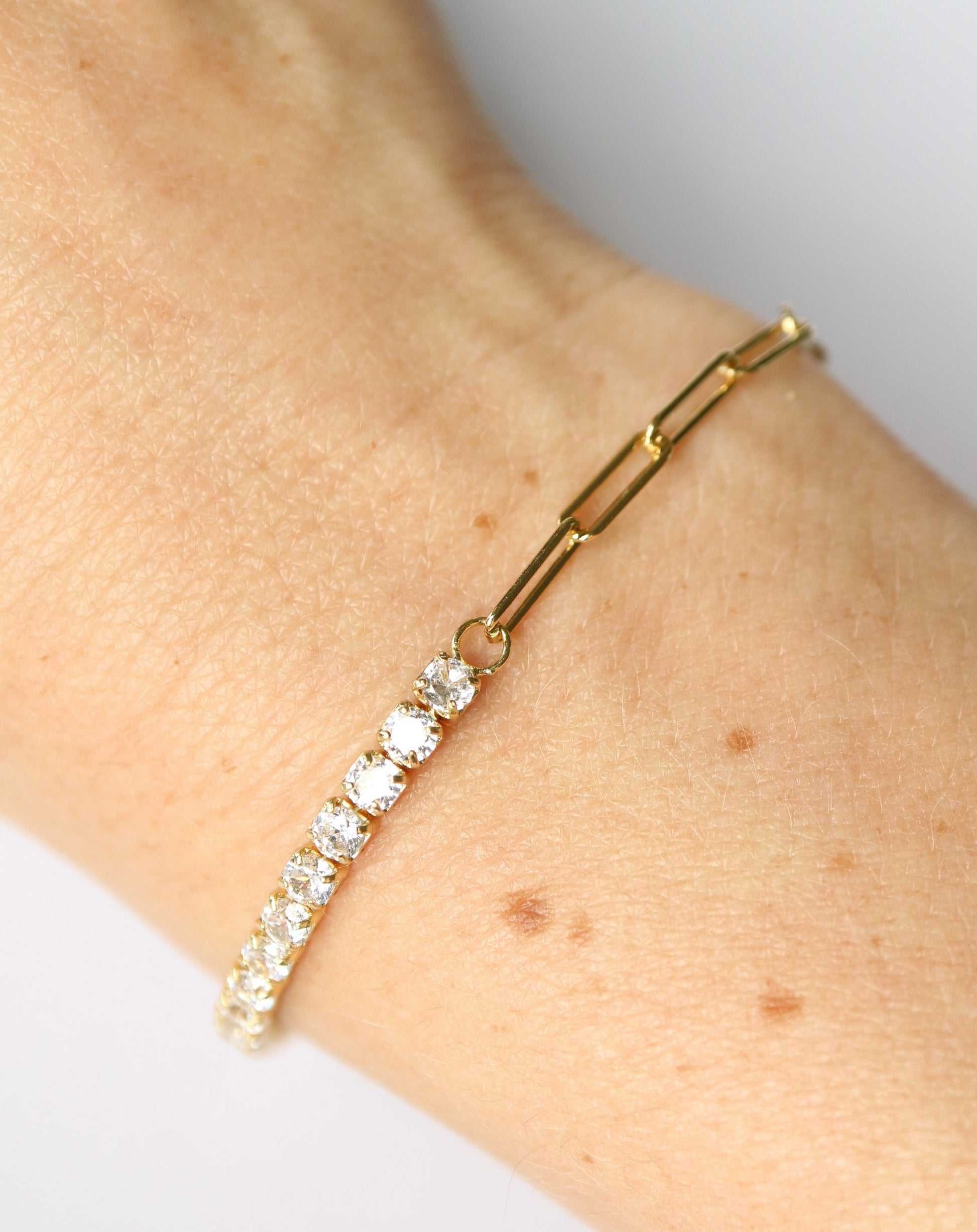 Half and Half Paperclip Tennis Bracelet in gold on wrist