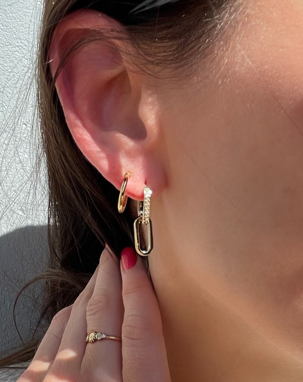 woman wearing hoop earrings