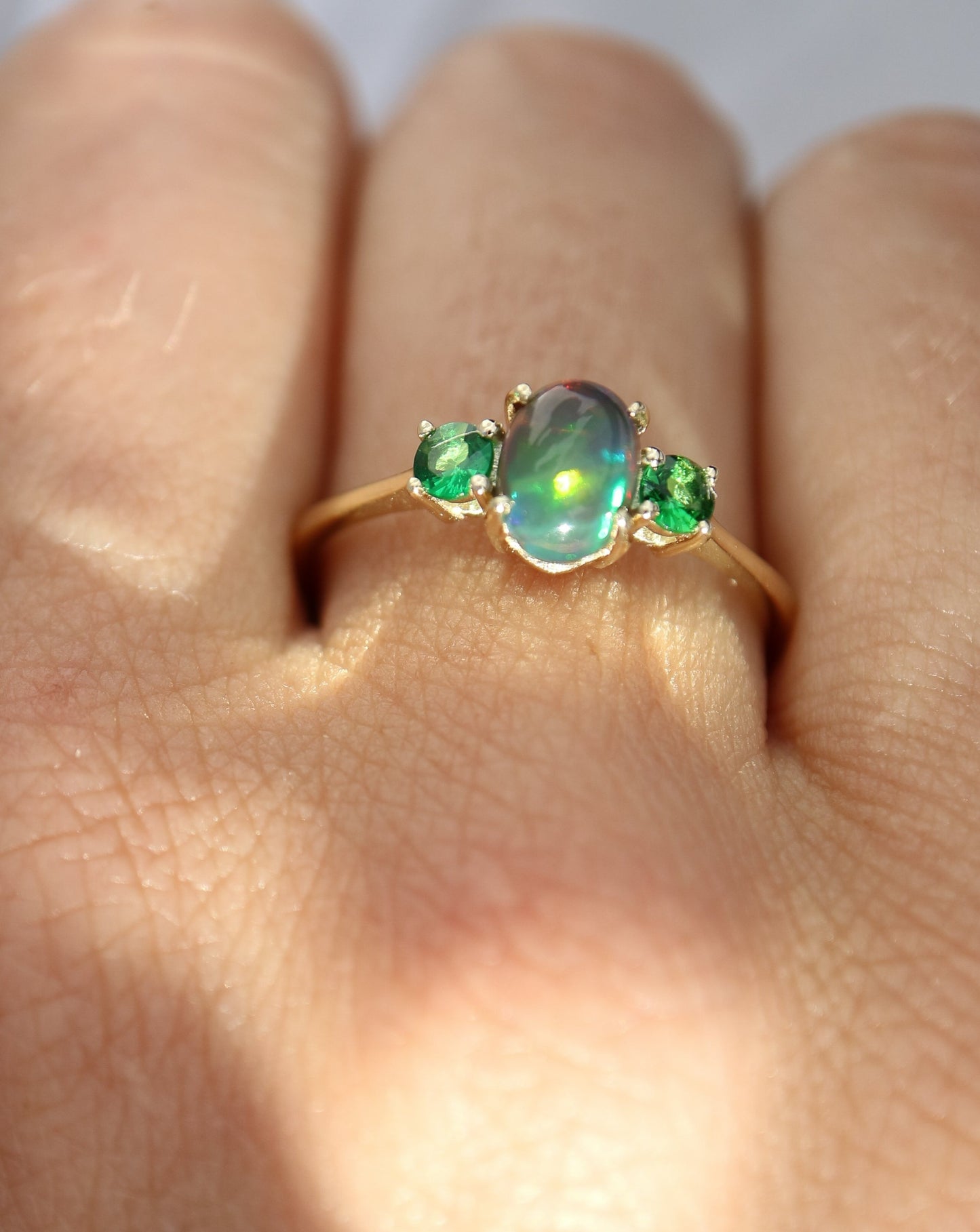 9kt gold ring with Ethiopian opal and tsavorite