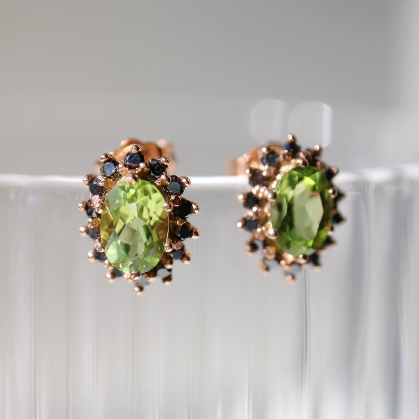 9kt rose gold earrings with peridot and black diamonds