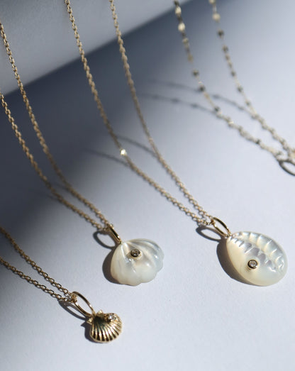 9kt gold and diamond shell pendant