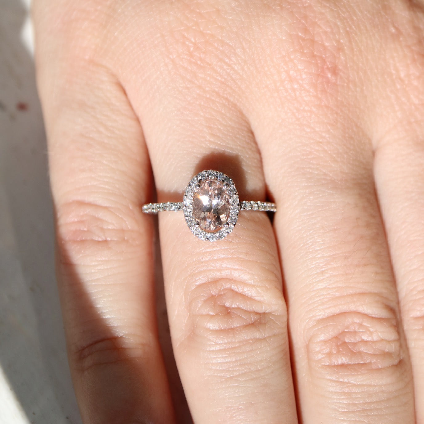 9ct white gold, morganite and diamond halo engagement ring