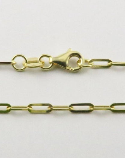 Close up of gold paperclip chain links shown on white