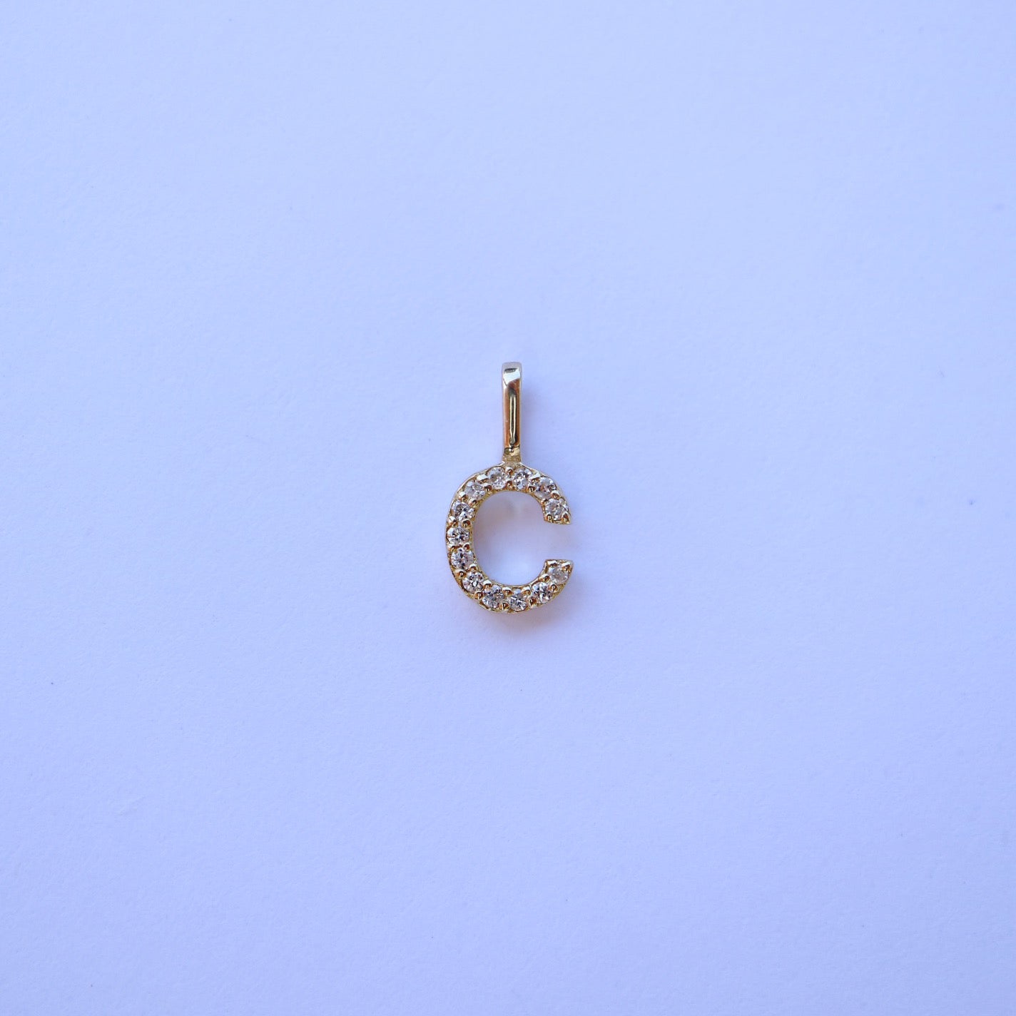 9kt gold and diamond initial pendants by Collective & Co.