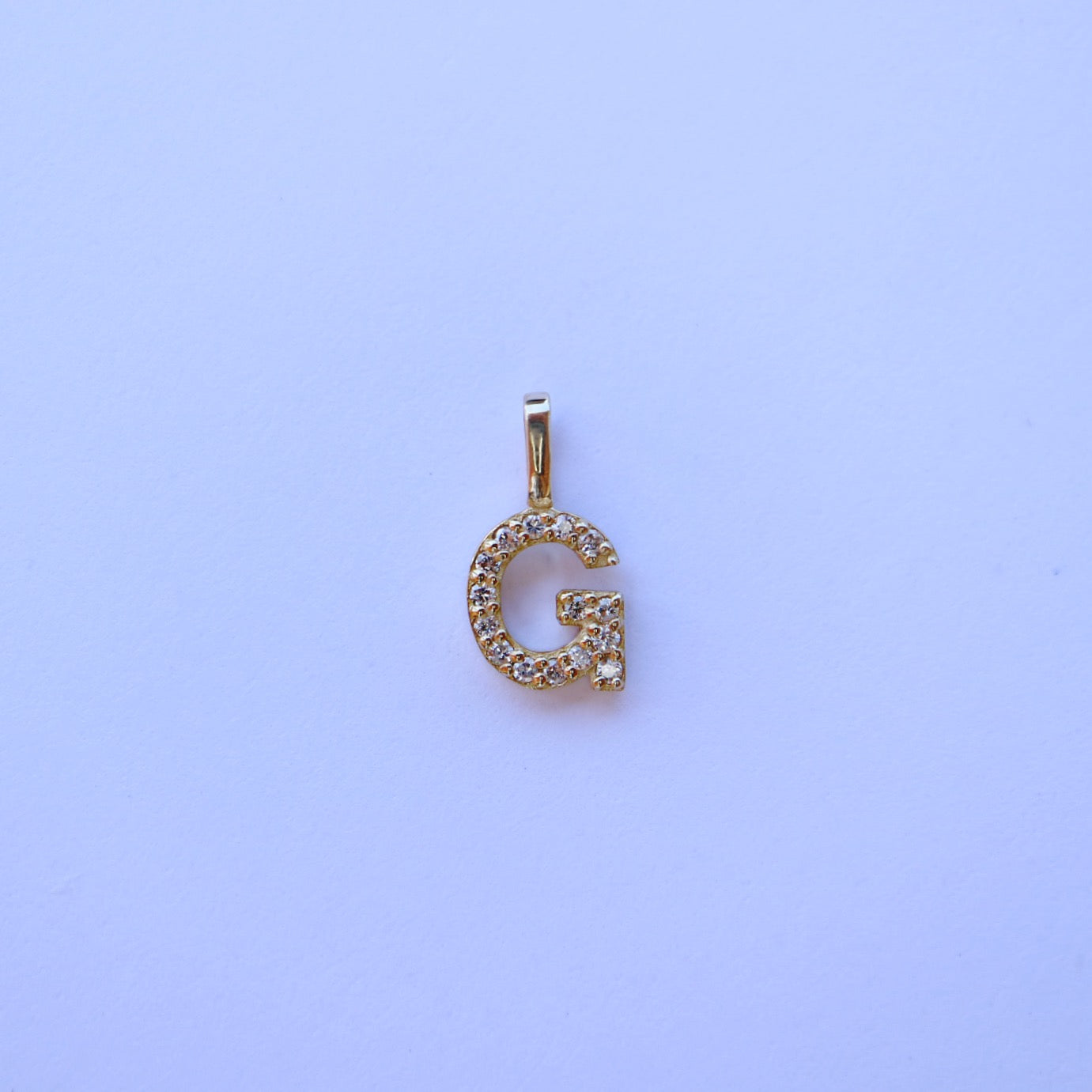 9kt gold and diamond initial pendants by Collective & Co.