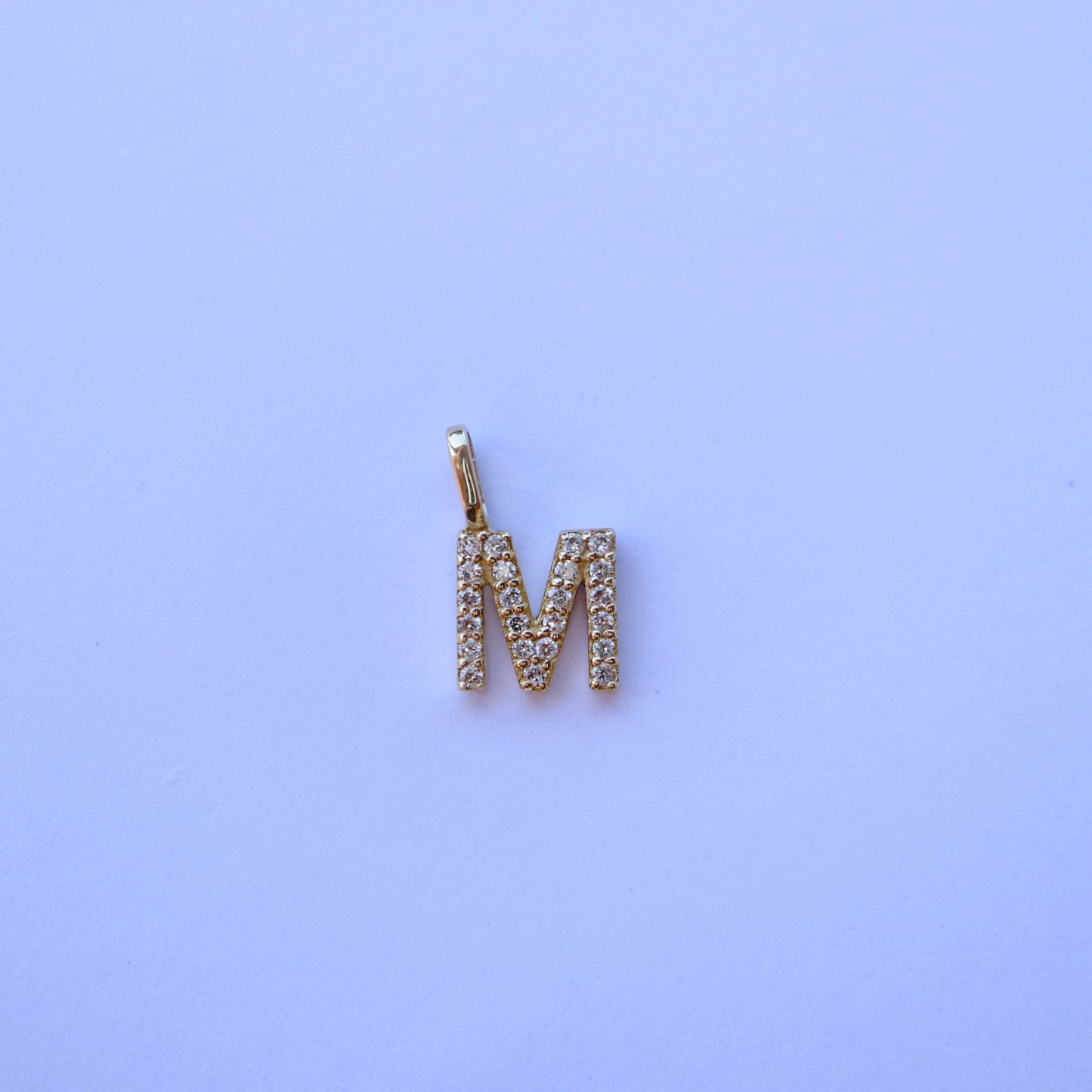 9kt gold and diamond initial pendants by Collective & Co.