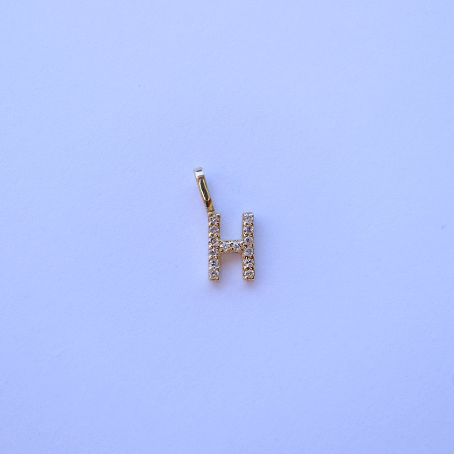 9kt gold and diamond initial pendants by Collective & Co.