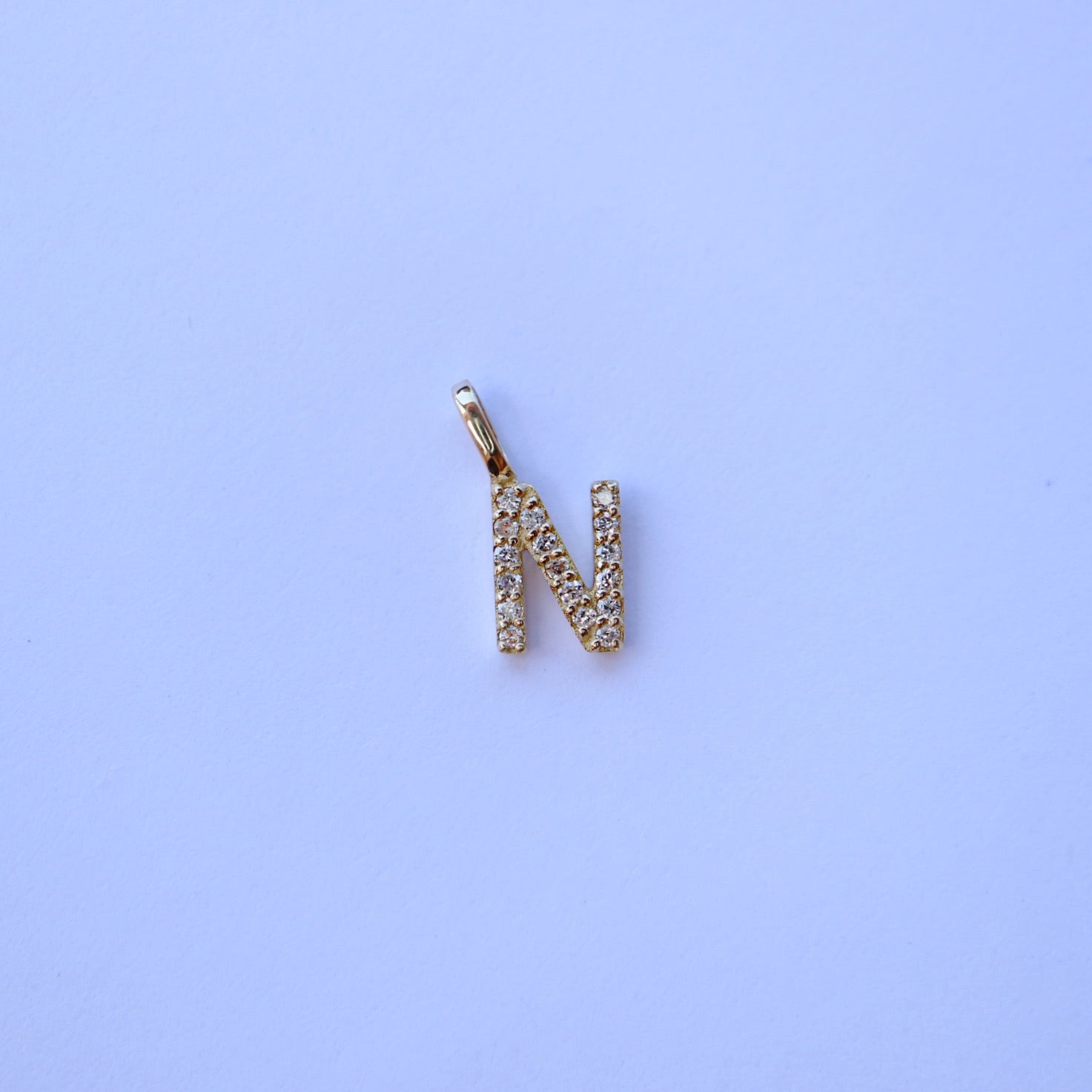 9kt gold and diamond initial pendants by Collective & Co.