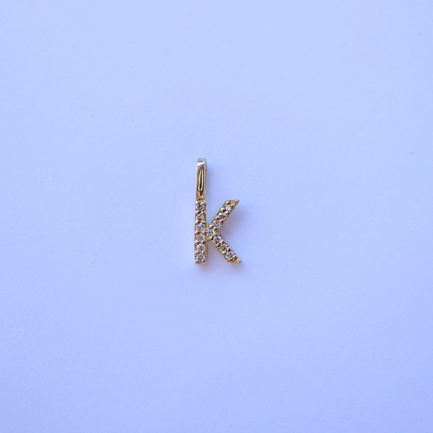 9kt gold and diamond initial pendants by Collective & Co.