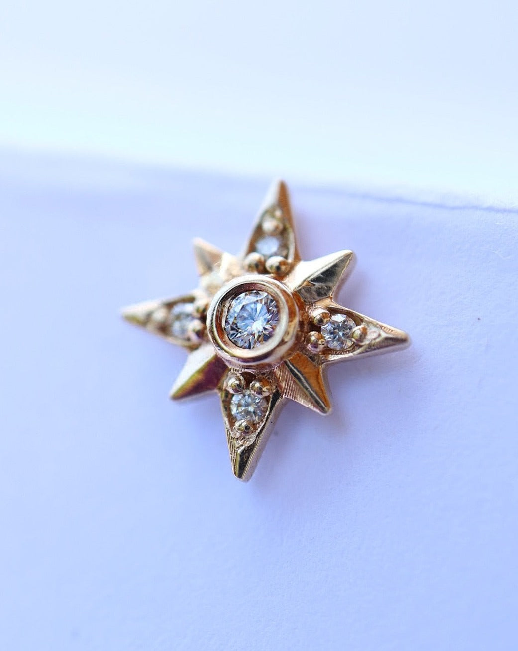 14kt gold and diamonds northern star piercing stud from My Peach Jewels