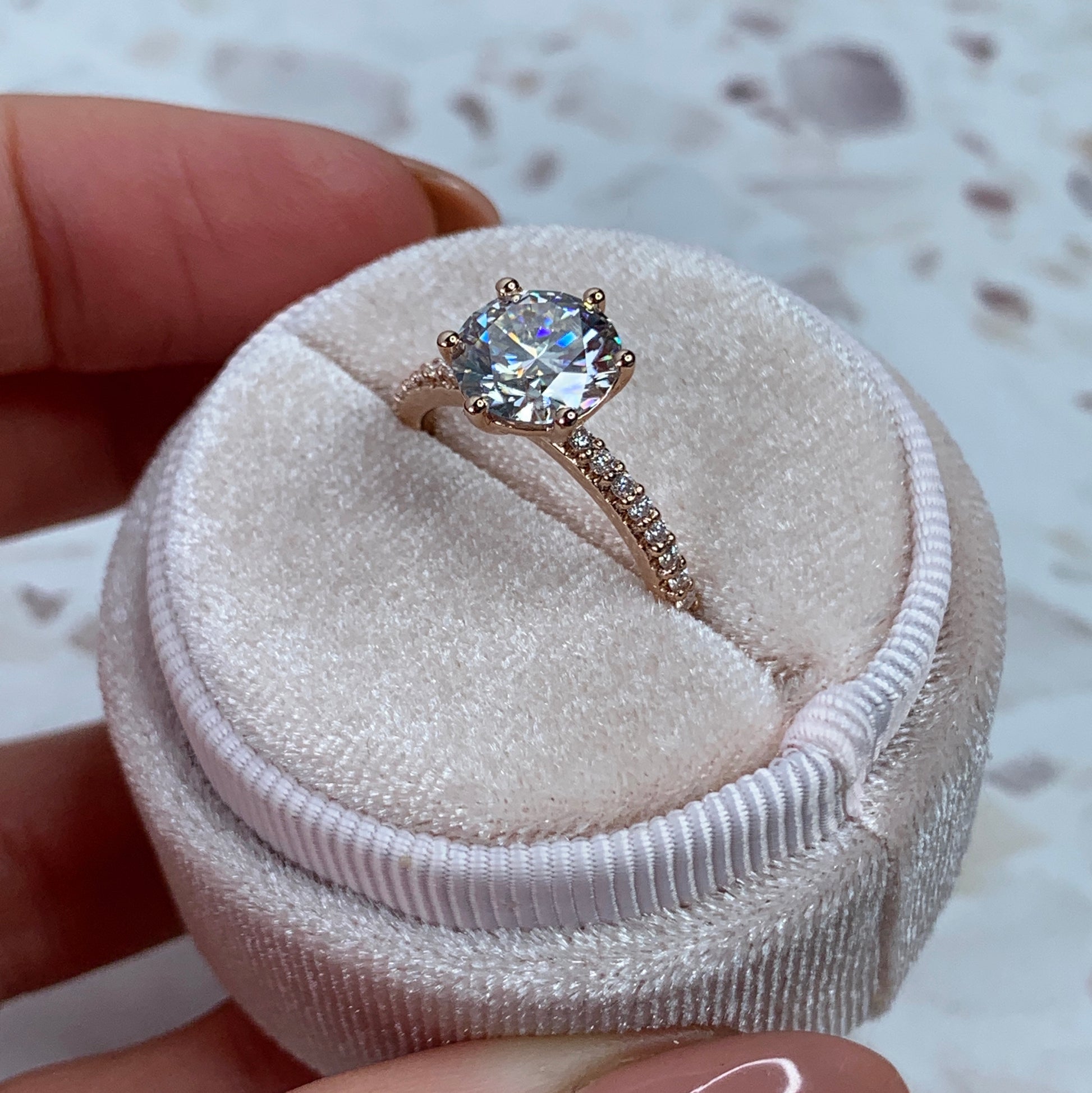 Round brilliant engagement ring with pavé-band