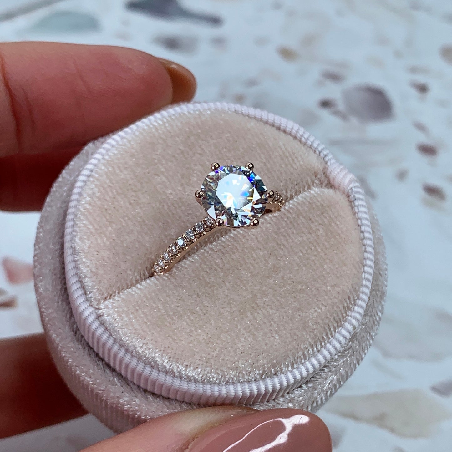 Round brilliant engagement ring with pavé-band