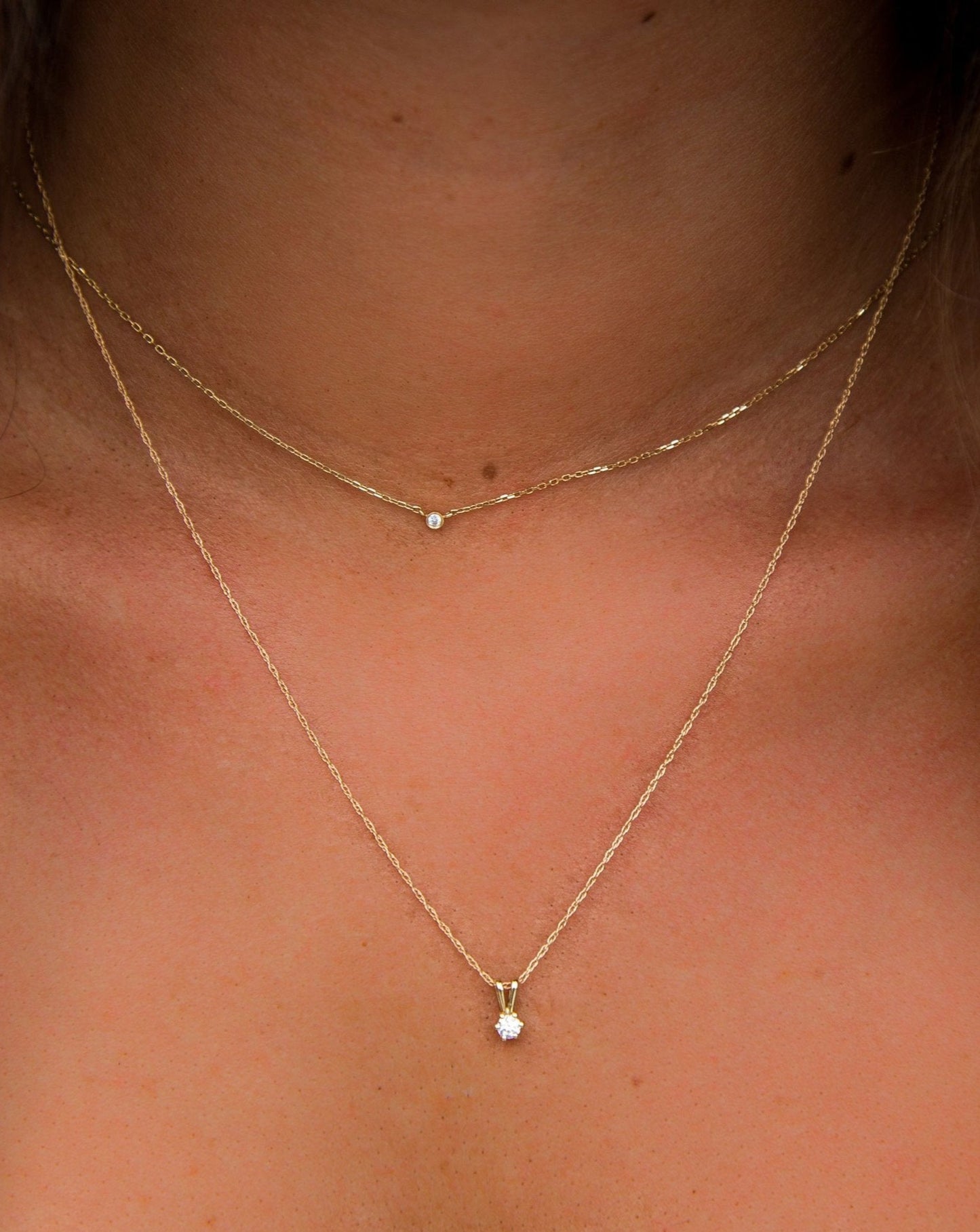 Diamond Diaz Pendant layered with Solo Diamond Pendant on neck