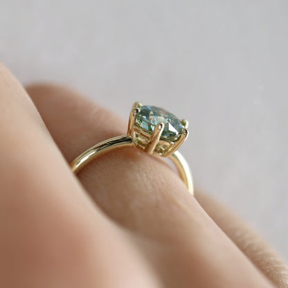 Solid gold and blue moissanite ring