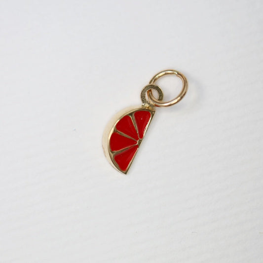 Gold charm with enamel