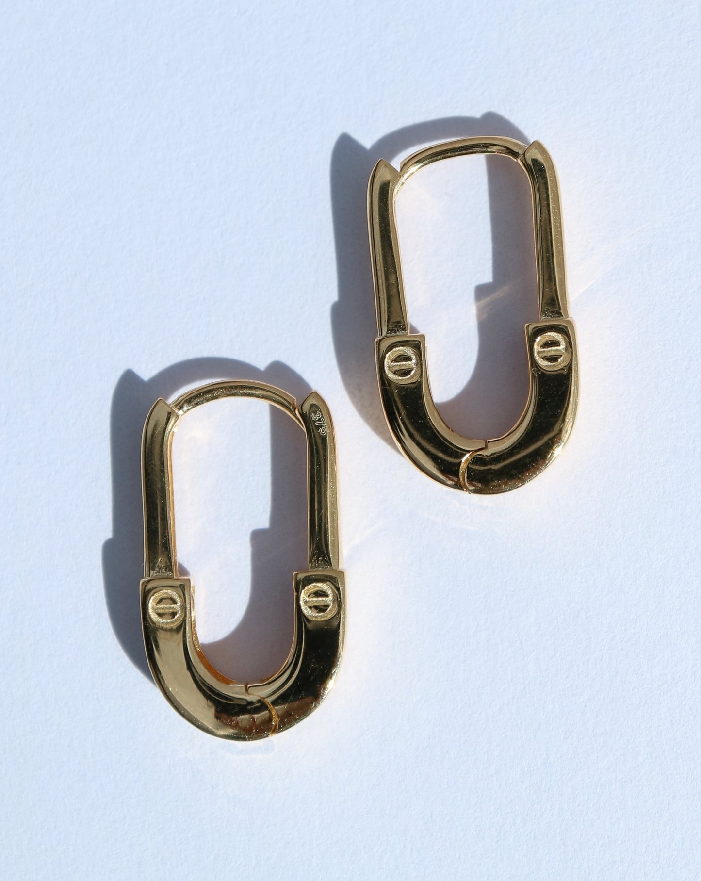 9kt gold oval huggie earrings