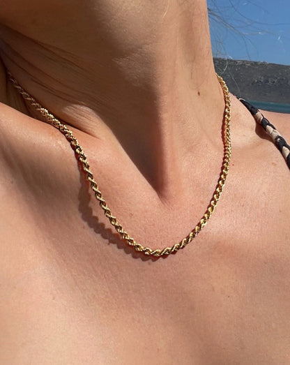 9ct gold twisted rope chain on female neck