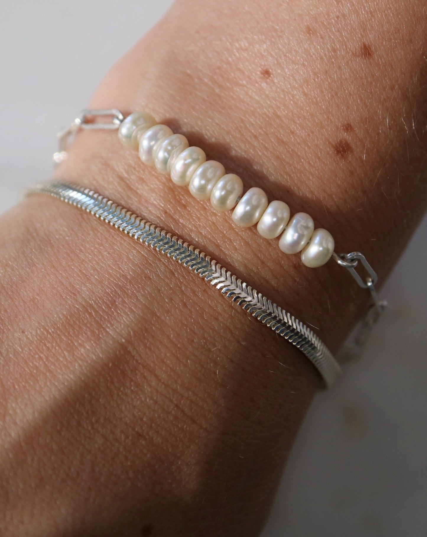 Silver bracelets stacked