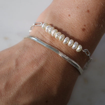 Silver bracelets stacked