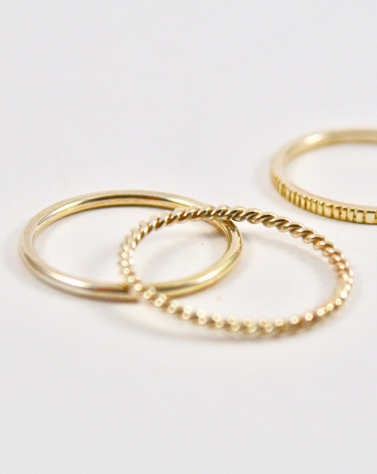Three 9ct gold stacking rings from jade Rabbit jewellery