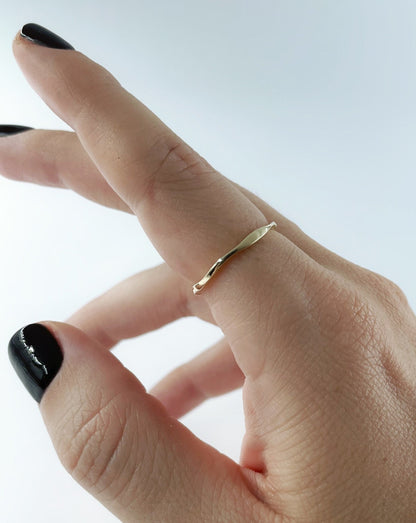 9ct gold wobble ring shown on female hand